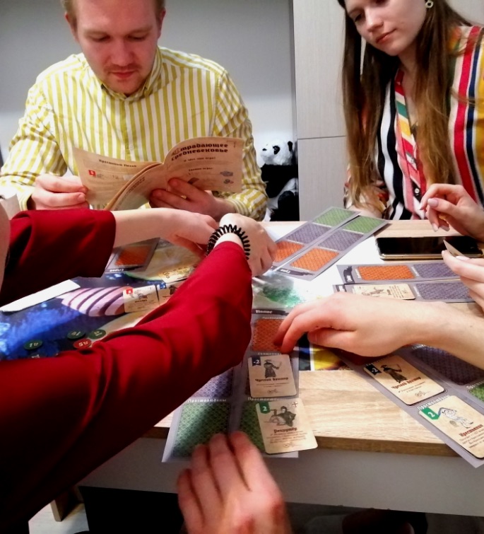 People playing board game